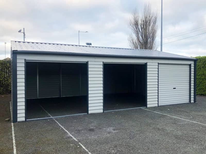 image of white custom garage installed by Urban Garden Sheds