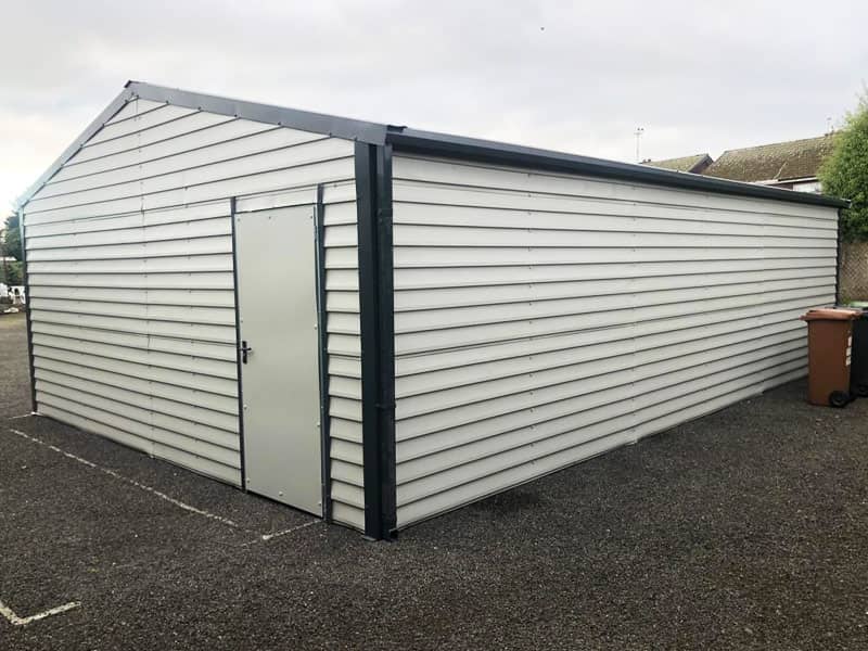 image of white custom garage installed by Urban Garden Sheds