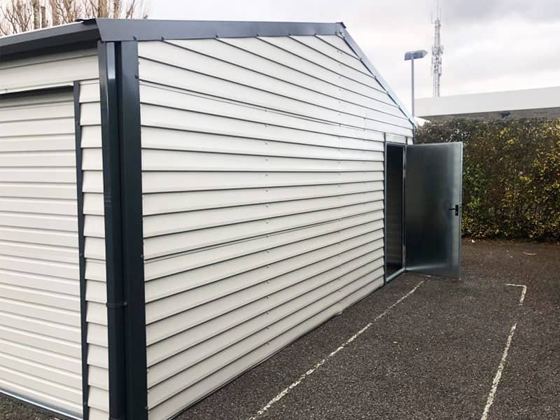 image of white custom garage installed by Urban Garden Sheds