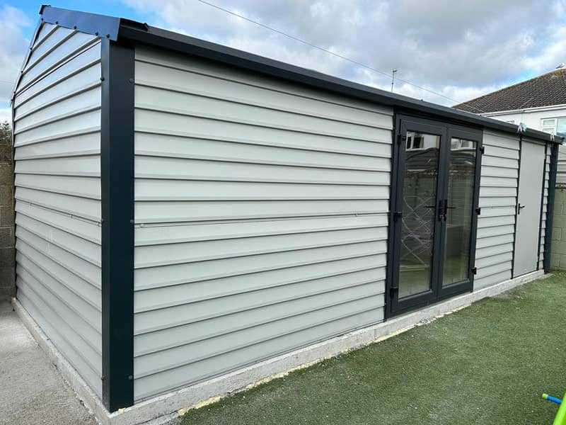 image of white custom garage installed by Urban Garden Sheds