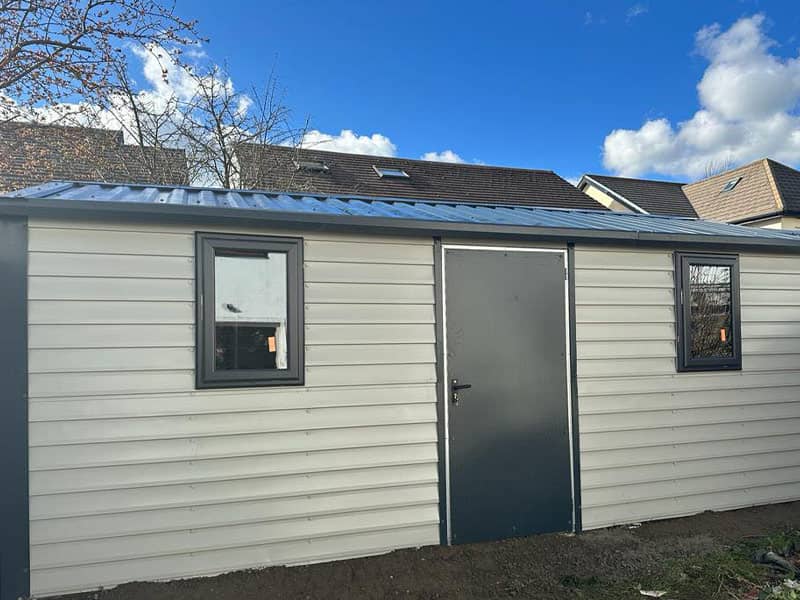 image of white custom garage installed by Urban Garden Sheds