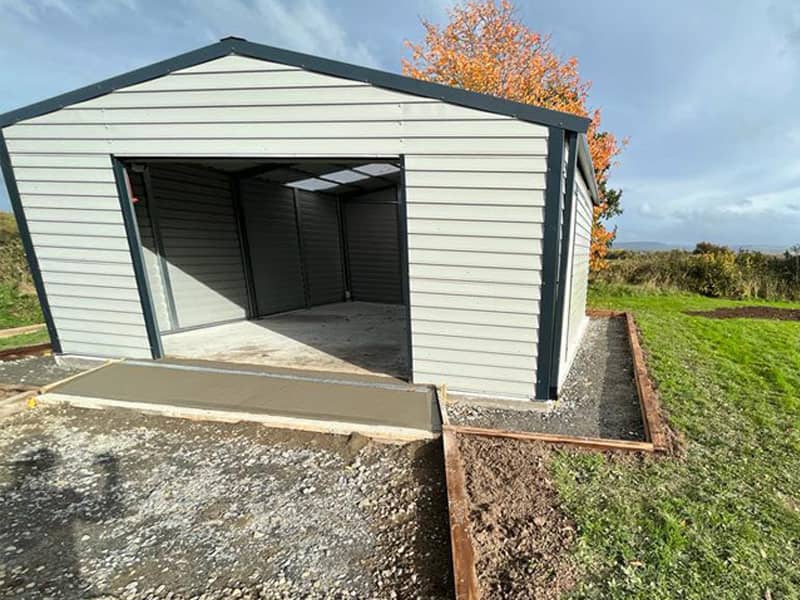 image of white custom garage installed by Urban Garden Sheds