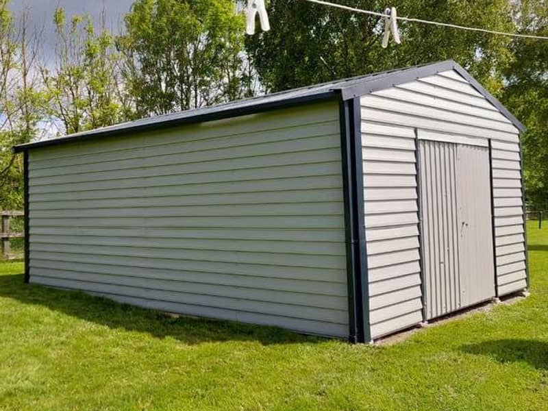 image of white custom garage installed by Urban Garden Sheds