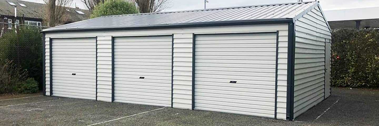image of white custom garage installed by Urban Garden Sheds